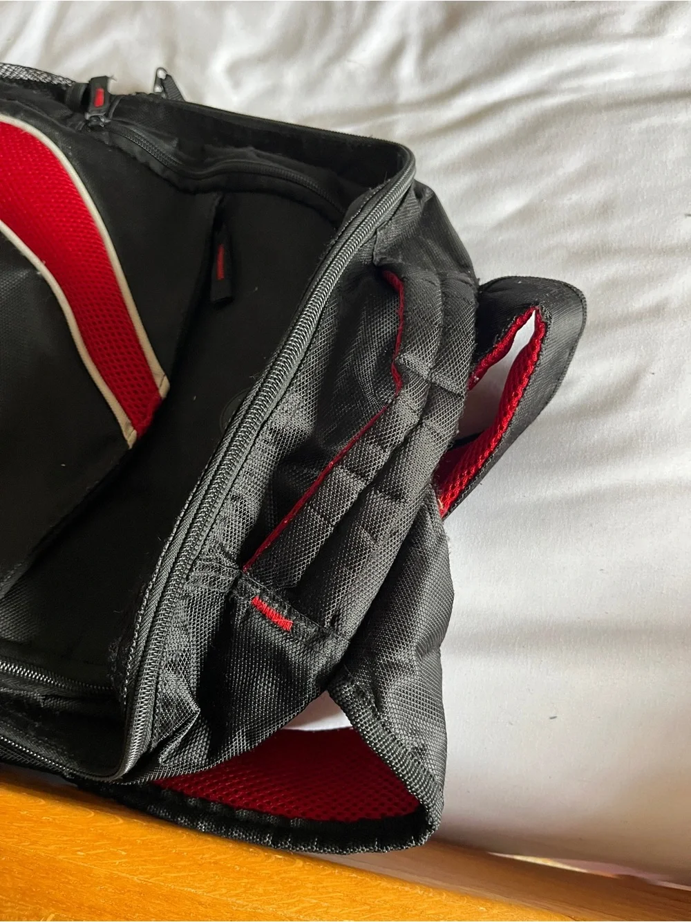 Black & Red Multi-Pocket Backpack with Media Port & Mesh Side Pockets